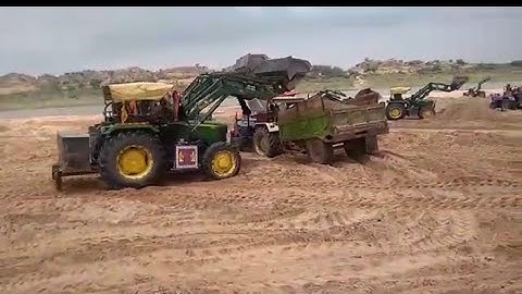Clay bucket loader mounted on Jhondeer