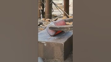 Forging a rectangular iron block into a cylinder