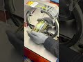 Wrapping the small metal piece tightly with clear tape for a secure and neat package #machine