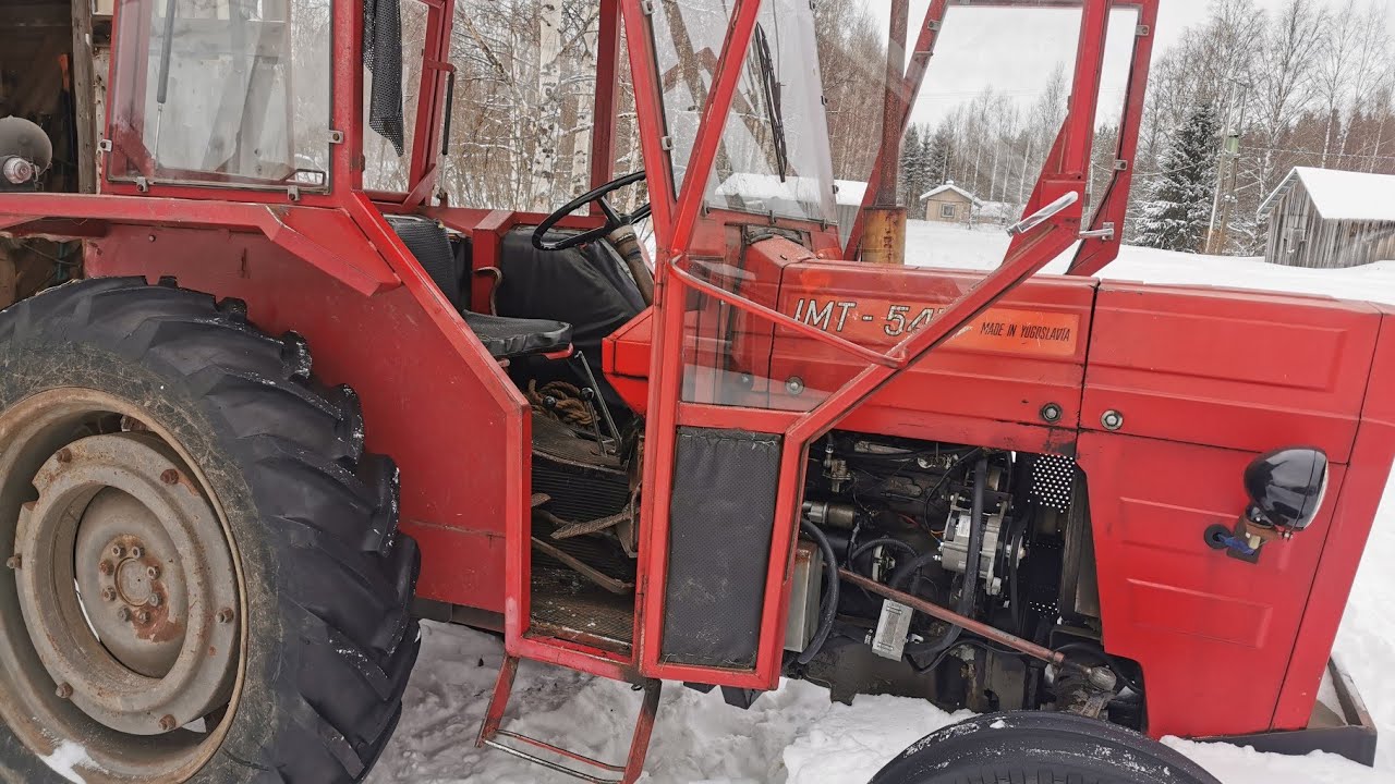 Traktorin herättelyä pakkasten jälkeen