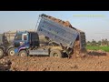 ឡានប៊ែនចាក់ដី អាប៊ុលរុញដី dump truck loading dirt and Komatsu bulldozer pushing dirt
