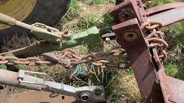 John Deere 4440 chisel plowing the new potato ground