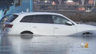 Cars stuck in frozen floodwaters in New Jersey