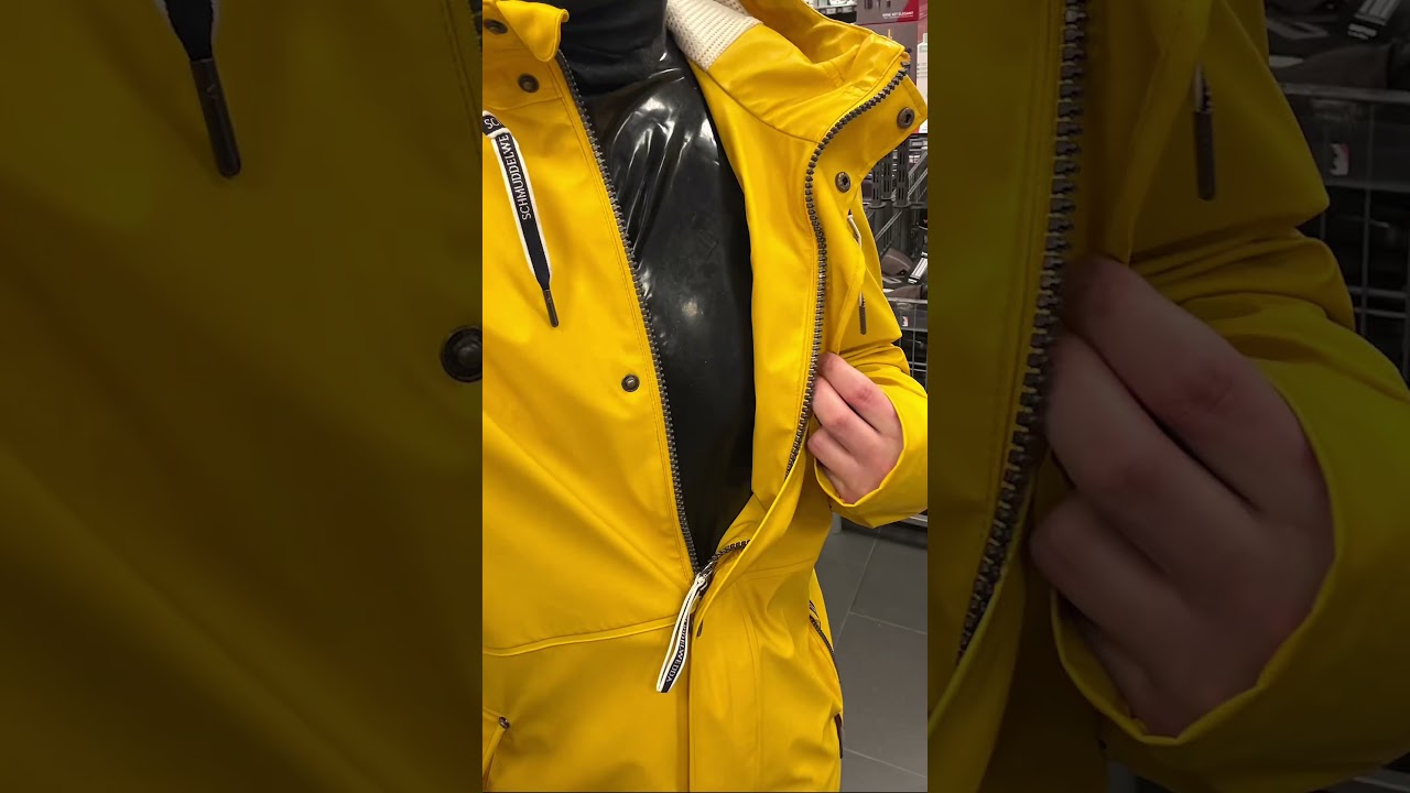Yellow Raincoat From Schmuddelwedda an Full Latex Catsuit