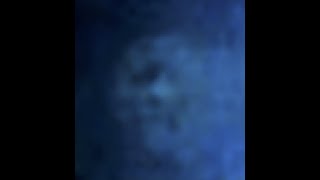 Caught on camera: Blue Orb zoomed in with several faces seen inside!
