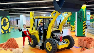 Sofia and Max play at the Children&#39;s Center and ride a tractor