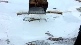 Ice Fishing With An Excavator