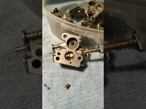 Video: Yuav ua li cas kho lub carburetor ntawm Husqvarna 235?