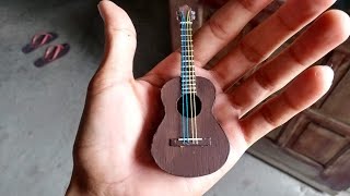 Como fazer um mini violão de Papelão (TUTORIAL) violão feito com papelão e caixa de remédio