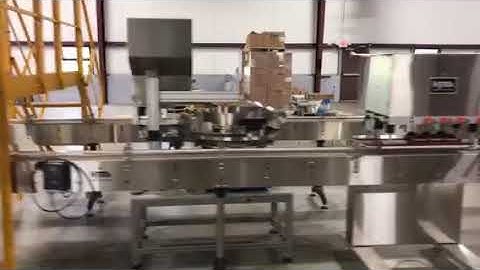 HyTek Automation Solutions - 150ft long production line with 12 head HyTek Liquid Filler and HyTek