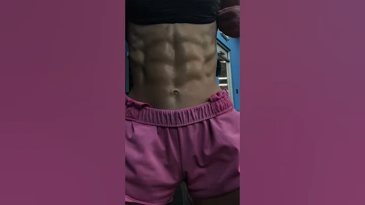 FBB Anna Hebert flexing shredded abs