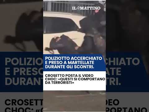 Video Poliziotto accerchiato e preso a martellate durante gli scontri: «Si comportano da terroristi»