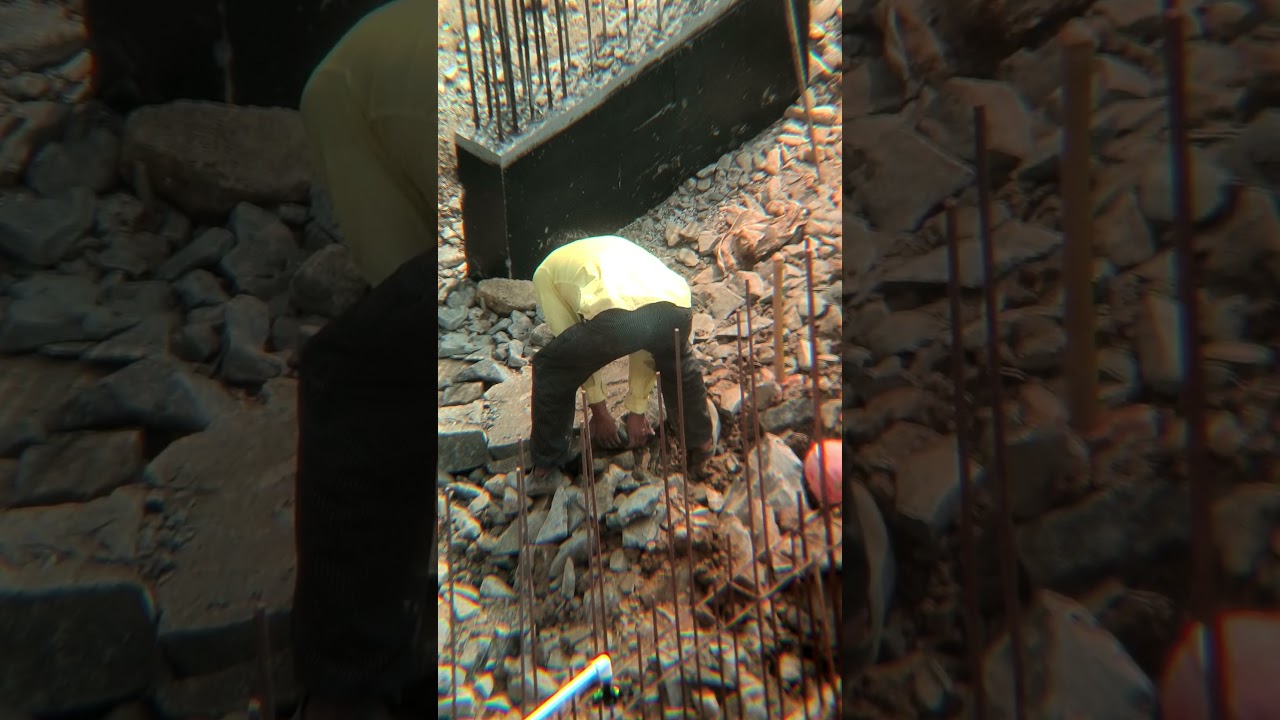 Worker moving a heavy stone 