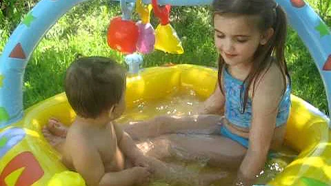 Taina Veilleux & Sister AAliyah Lee Veilleux Metallic playing in pool