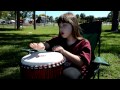Shelly drumming on the djembe hand drum