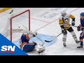 Semyon varlamov slips on the ice to give sidney crosby wide open net to score on