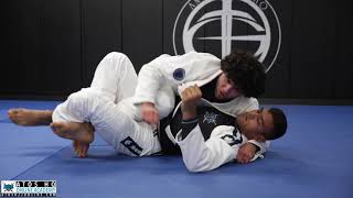 Half guard pass using the lapel to mount + collar choke - Mike Carbullido