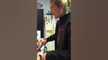 Guy struggles to flip a massive pancake!