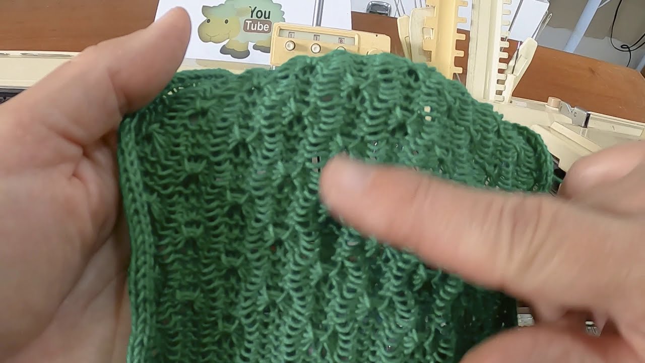 ponto manual feito em máquina de tricô