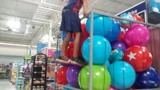 Adden Jumping In A Ball Cage At WalMart