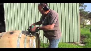 How to build a low cost, very cool smoker from a used wine barrel. Check my other movies for how to cook in the smoker. See 