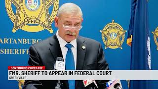 Former Spartanburg County sheriff Chuck Wright walks behind me to face a slew of federal charges.