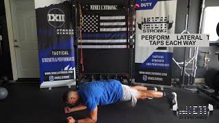 Plank with Lateral Toe Taps
