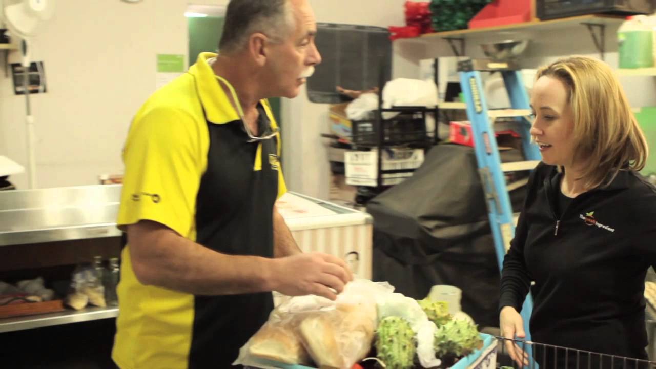 Newcastle Knights' Robbie Rochow heads out with the crew of nib foundation partner, OzHarvest.