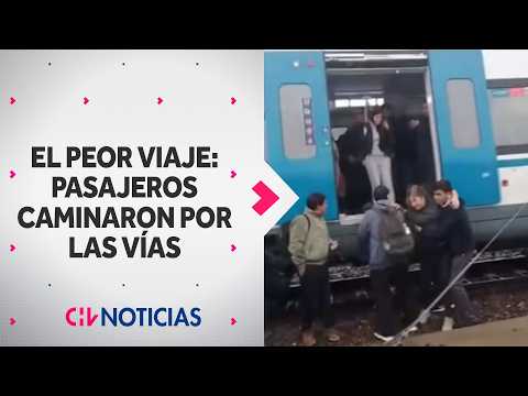 RISKY MOVE: Rancagua-bound train passengers stranded and walk along the tracks