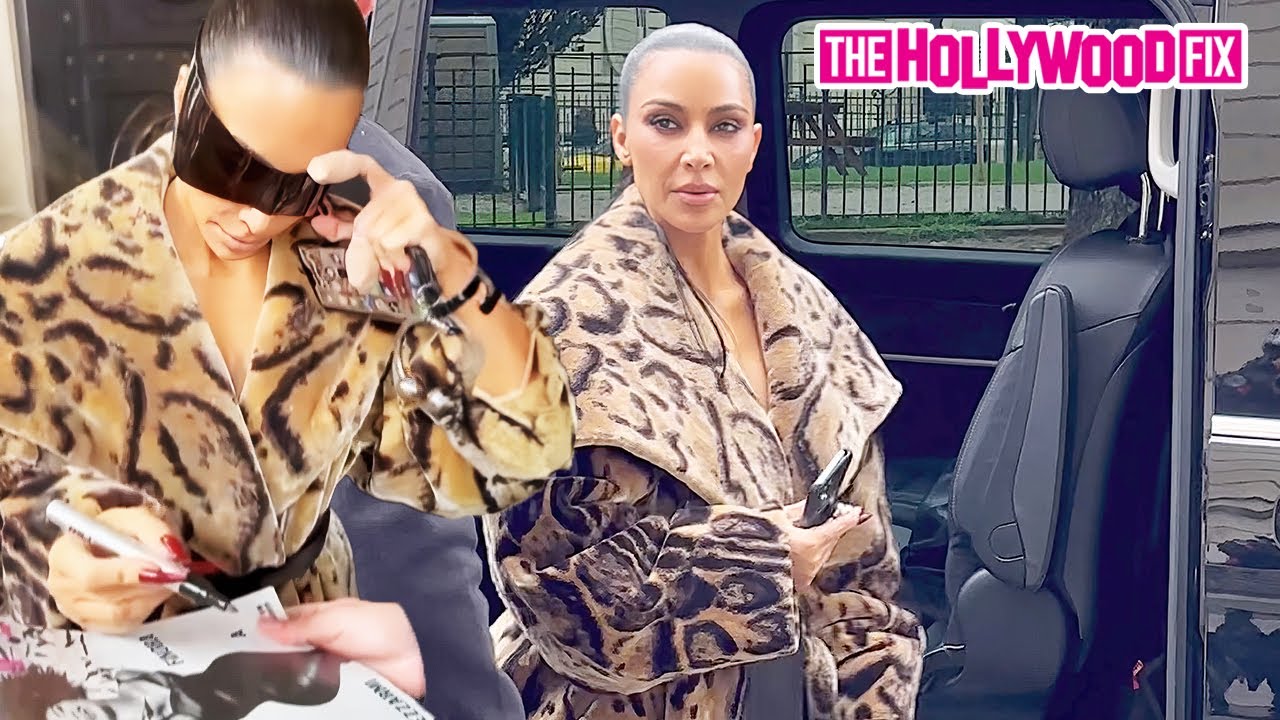 Kim Kardashian Reveals The Home Screen On Her iPhone While Signing Autographs With Broken Fingers