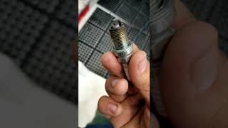 Suzuki 150 marine outboard spark plug change.