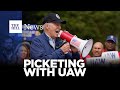 Biden Marches With Striking UAW Members