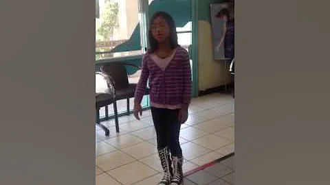 8-year old girl sings National Anthem