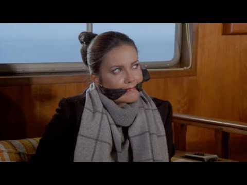 Wonder Woman/Diana Prince tied up and gaged on a boat
