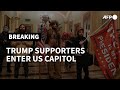 Supporters of US President Donald Trump enter the US Capitol | AFP