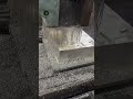 A CNC milling machine is performing metal processing.
