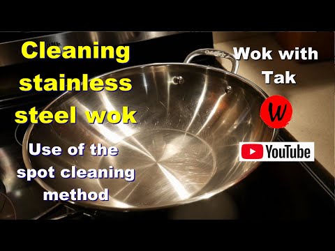 Cleaning stainless steel wok.  Use of the spot cleaning method.