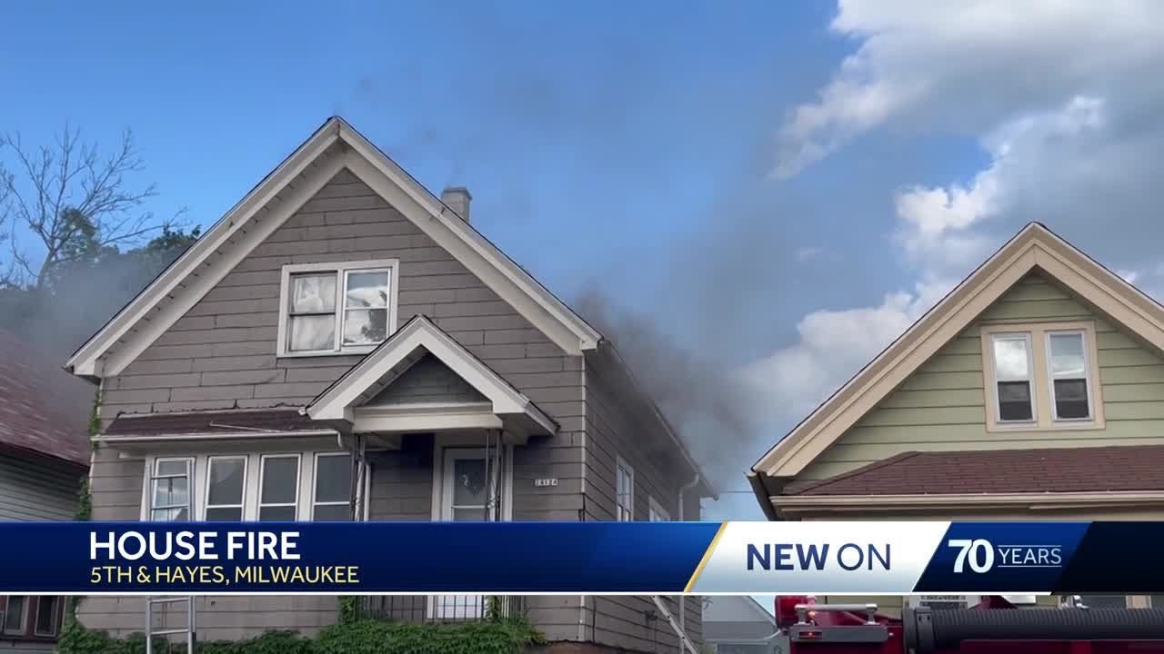 Four people rescued from house fire in Milwaukee - YouTube