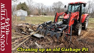 Digging out an old garbage pit we found on our property.