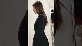 #KaiaGerber wears a black tailored dress with sliced shoulders, boning and blood-red laced spine.