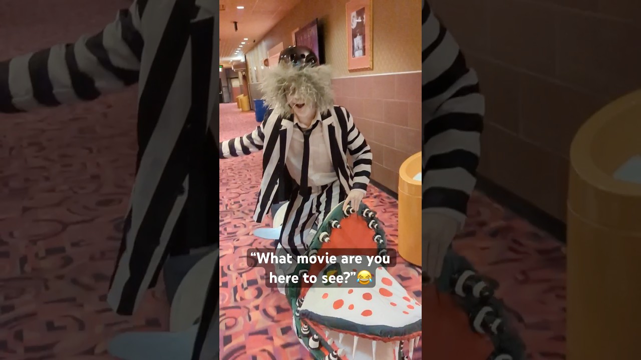 Beetlejuice rides a Onewheel in a movie theater 