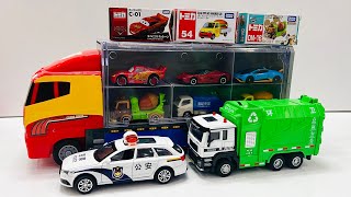 Box full of various miniature cars Peugeot, Volvo, Renault, Hyundai, Pagani, Cadillac One, DHL