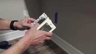 Add a RECESSED outlet from another room with little fishing or holes using Wiremold surface wiring