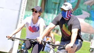 Pregnant Katherine Schwarzenegger and her husband Chris Pratt head out on a bike ride.