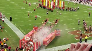 Kansas City Chiefs cheerleaders and players running out onto the field at Arrowhead  Stadium