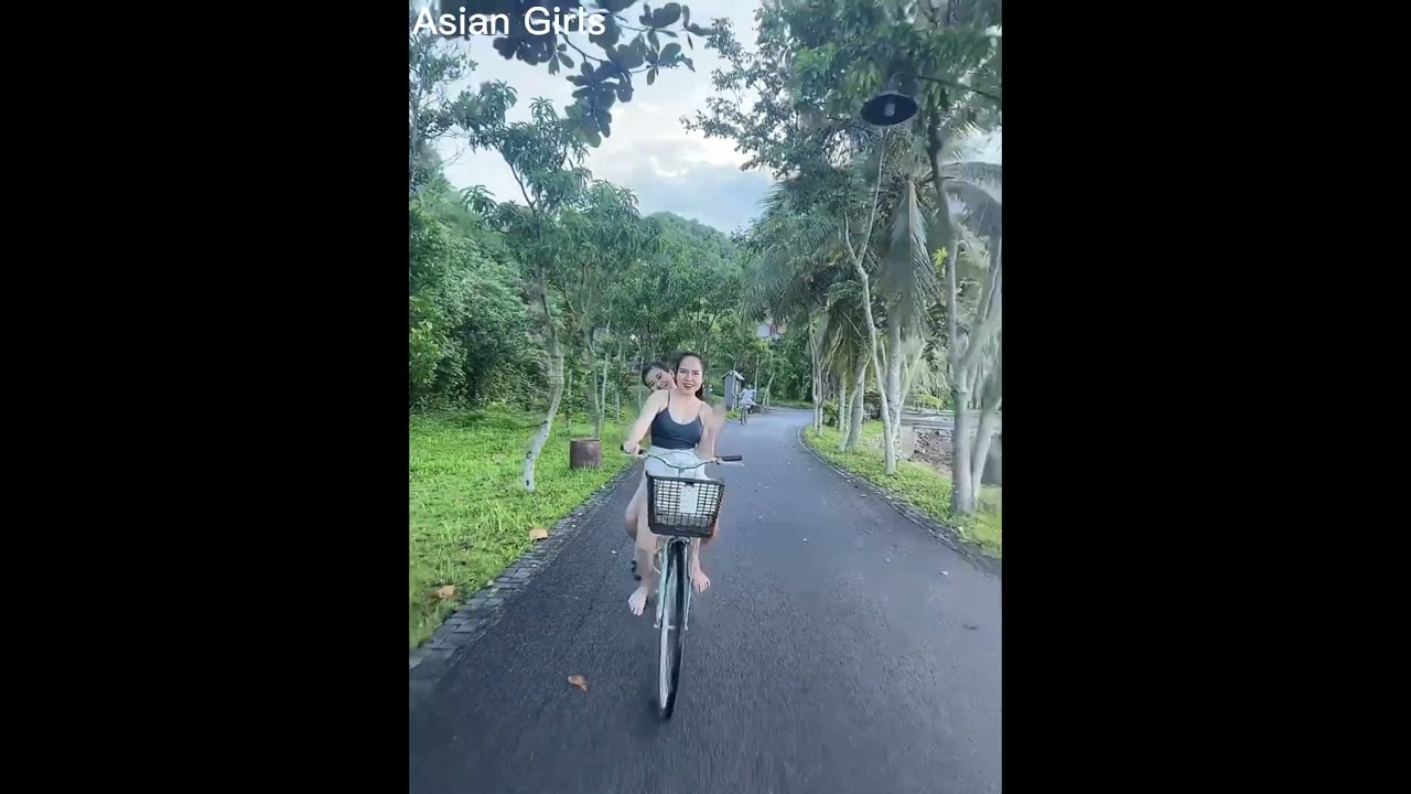 Asian girl while cycling 