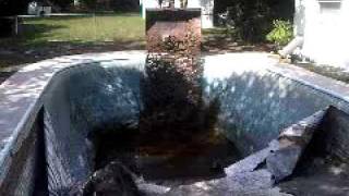 Pool demolition using a bobcat in orlando