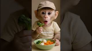 Baby Monkey Eating Broccoli