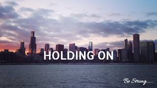 HOLDING ON