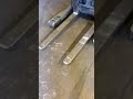 Picking up a quarter with a forklift